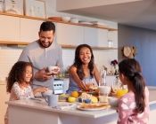 Family talking around the kitchen counter