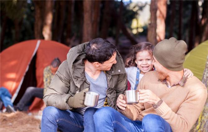 Family outside their tent