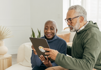 A couple looking at an iPad screen