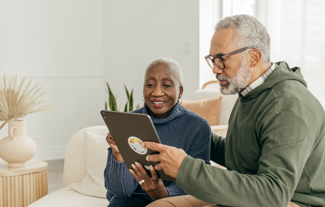 A couple looking at an iPad screen