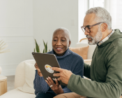 A couple looking at an iPad screen
